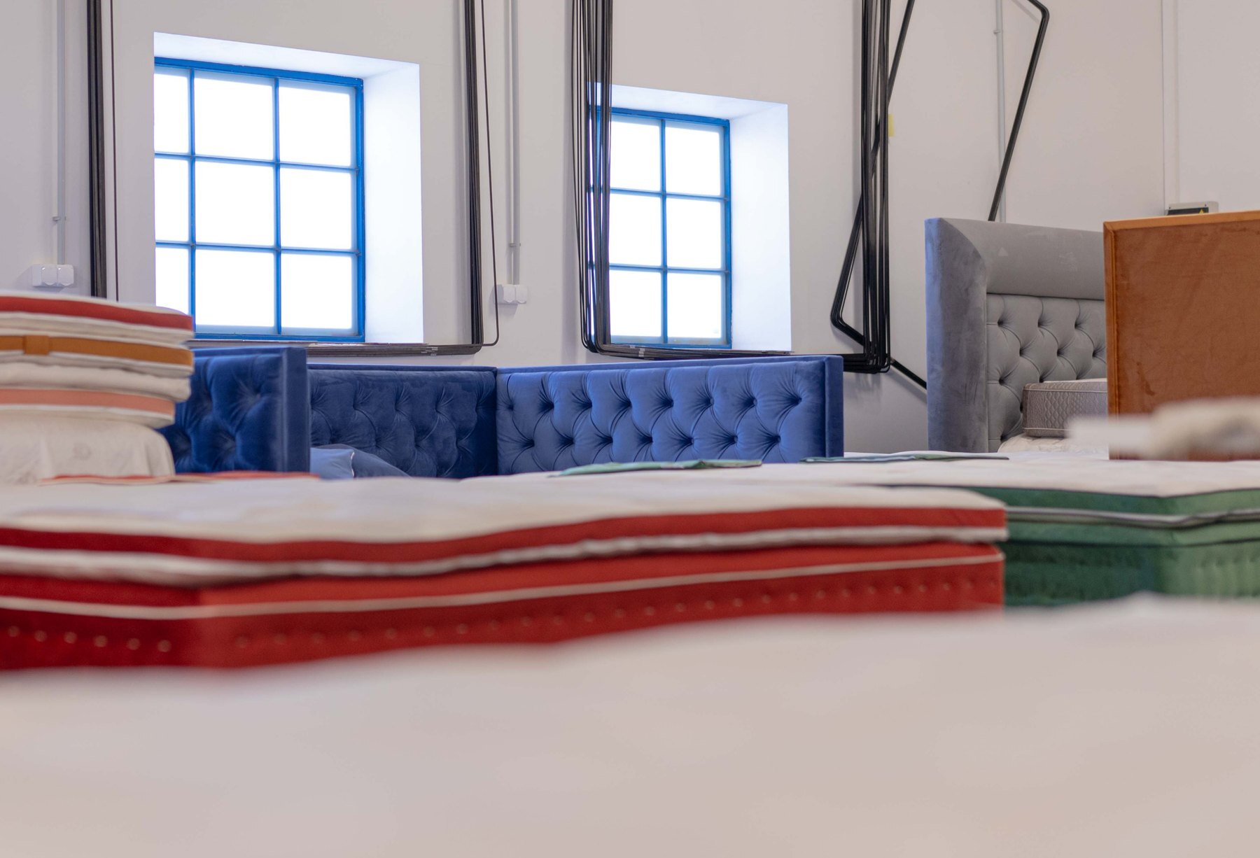 Folded fabrics and mattresses in the workshop